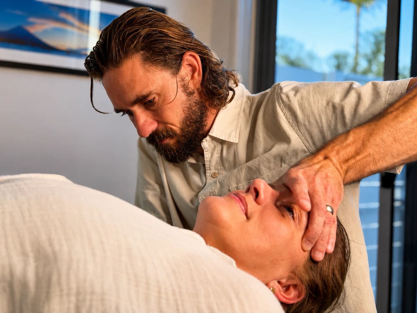 Dr Adam Williams working with a patient in the Casuarina studio